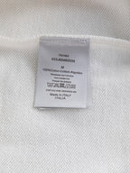 Dior hoodie care label tag with fabric info and Made in Italy