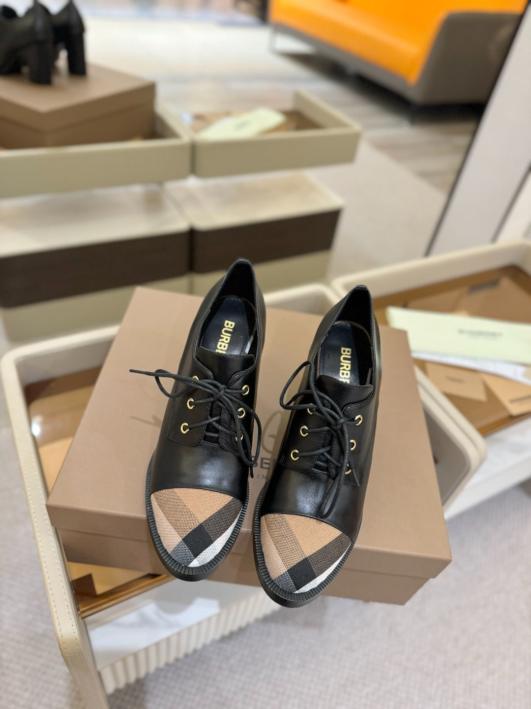 Black Burberry lace-up shoes with beige check toe panel