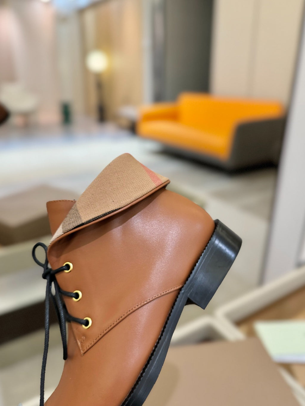 Burberry tan leather lace-up boot with beige tongue and dark rubber heel