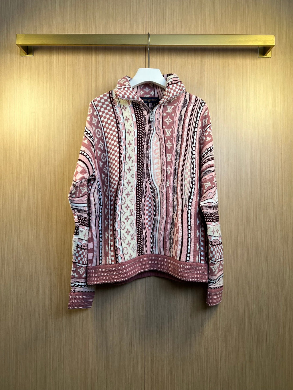 Long-sleeve cardigan with full front zipper, multicolor knit pattern, on hanger