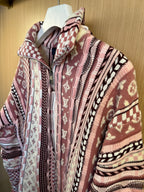Long-sleeve cardigan with stand collar and multicolor knit pattern, on hanger