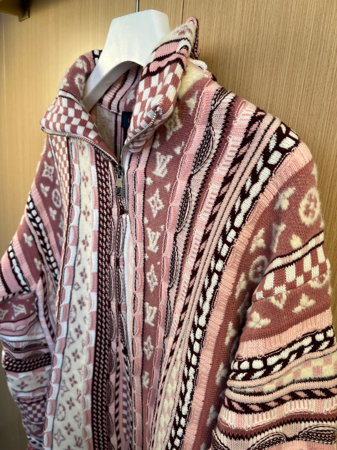 Long-sleeve cardigan with stand collar and multicolor knit pattern, on hanger
