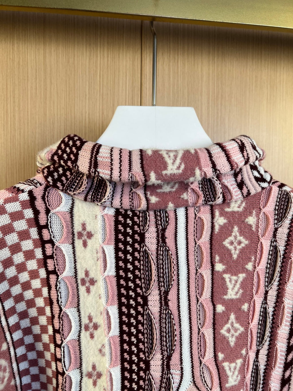 Long-sleeve cardigan neckline and back yoke, multicolor knit pattern on hanger