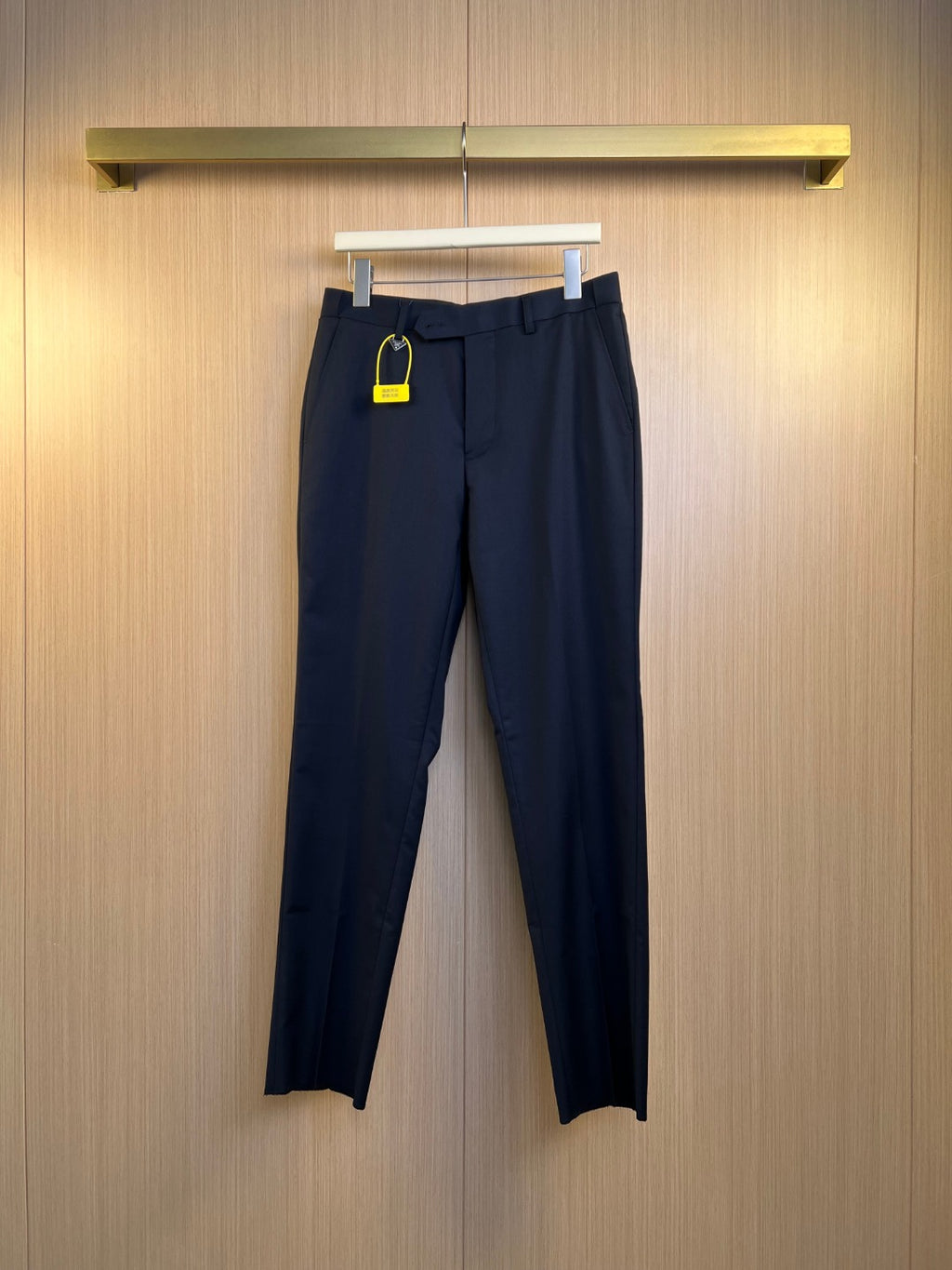 Navy dress pants with belt loops and two front pockets, Prada.