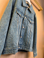 Denim jacket upper body with pointed collar, flap pockets, and round metal buttons.