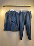 Navy blazer and matching trousers set, four-button front, notch lapels