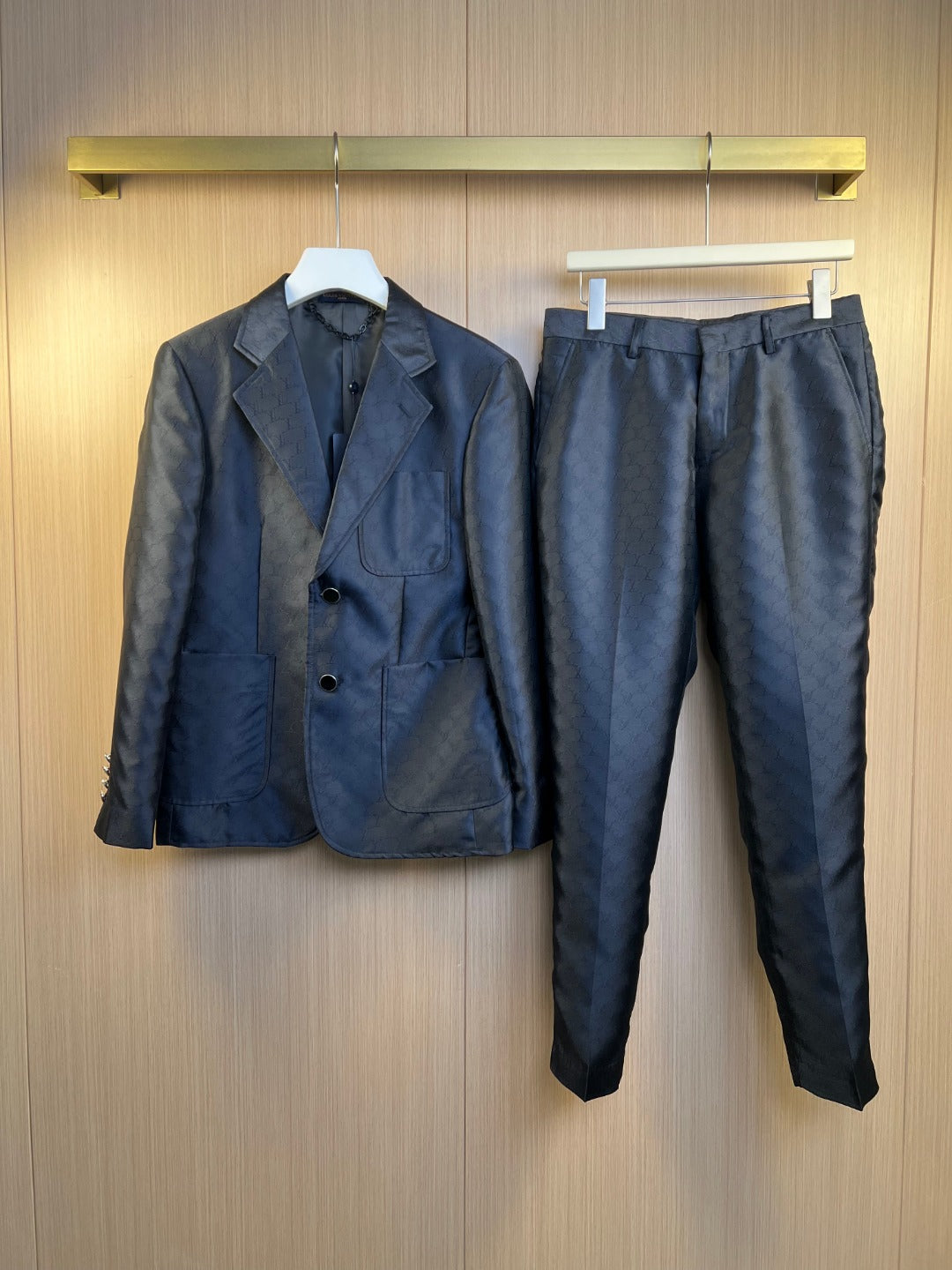Navy blazer and matching trousers set, four-button front, notch lapels