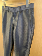 Louis Vuitton navy trousers with belt loops, pleated front, side pockets, monogram fabric.