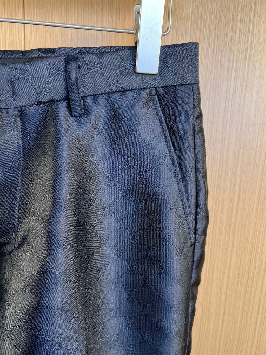 Louis Vuitton navy trousers waistband with belt loops and front pleat, monogram fabric.