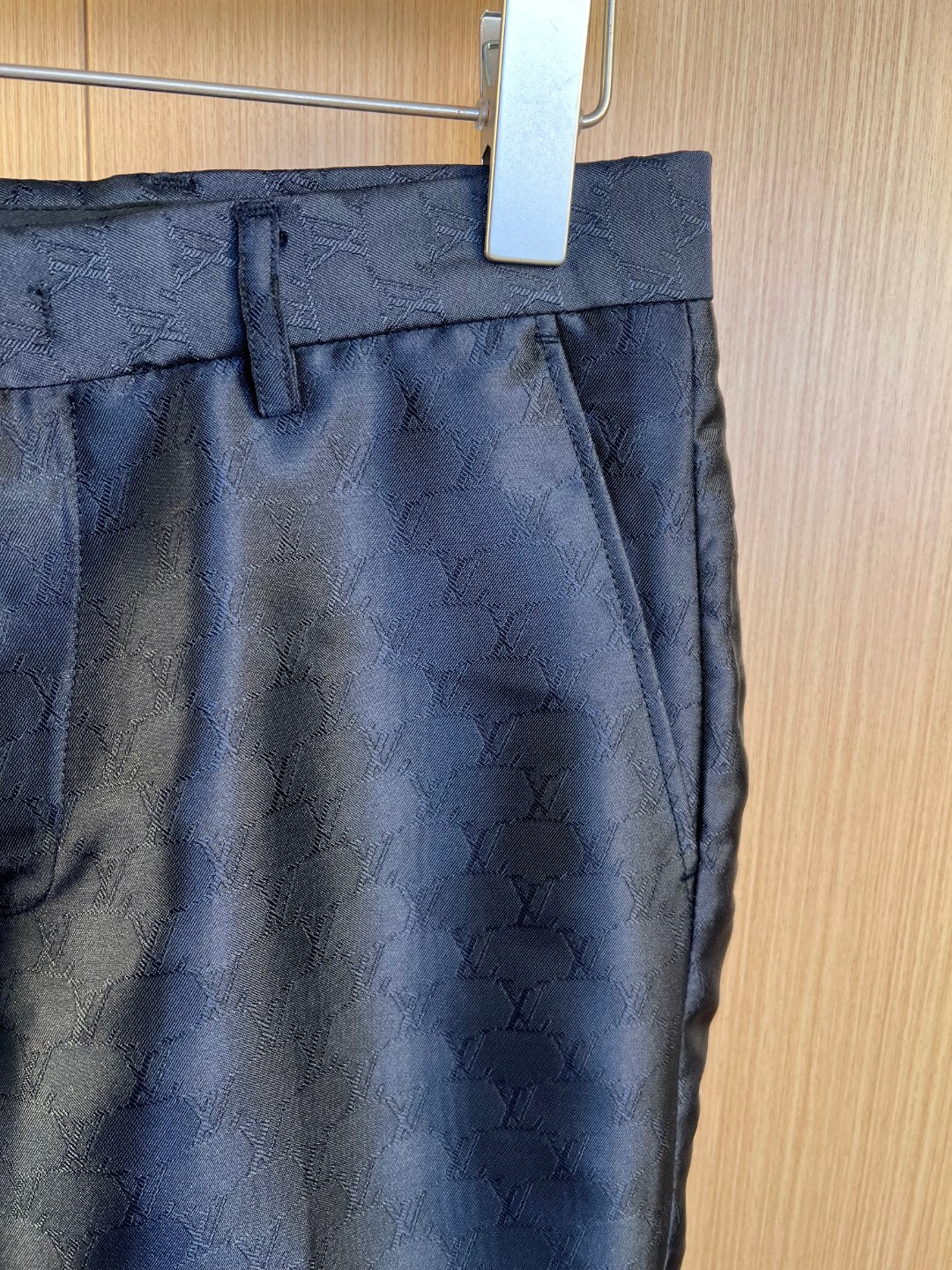 Louis Vuitton navy trousers waistband with belt loops and front pleat, monogram fabric.
