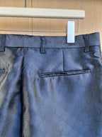 Louis Vuitton navy trousers waistband with belt loops and center pleat, monogram fabric.