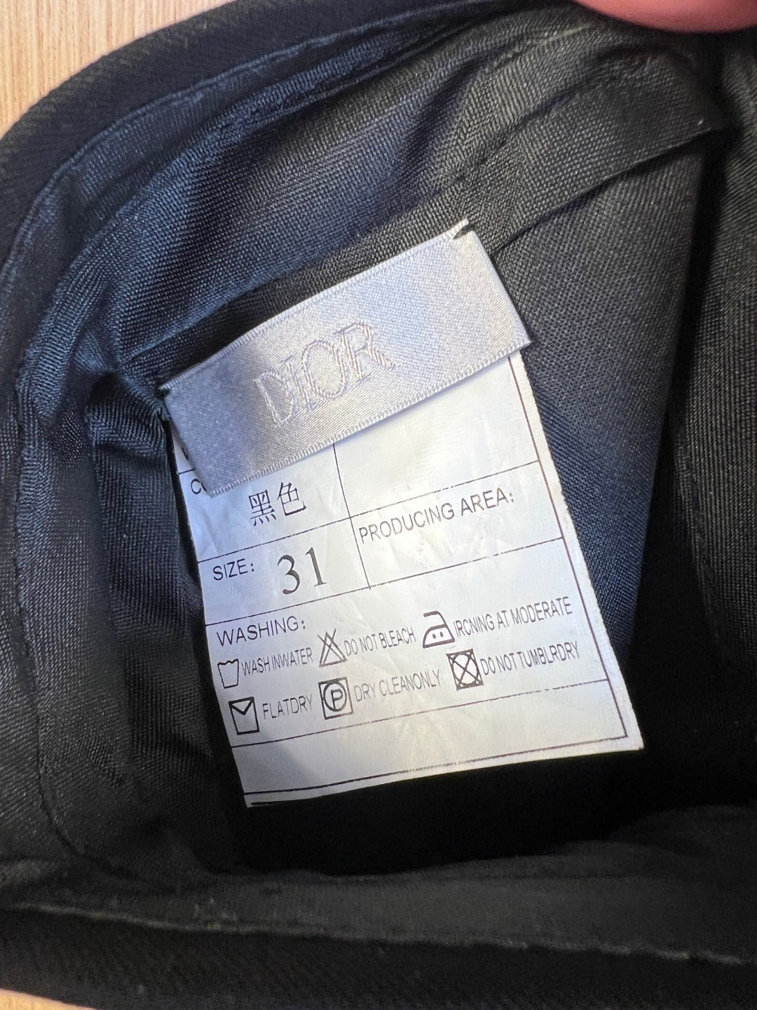 Care label inside pants showing size 31 and washing instructions