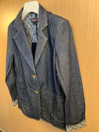 Dark blue denim jacket with interior monogram-style lining and gold button closure