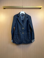 Dark blue denim jacket with notched lapels, front buttons, and two chest pockets