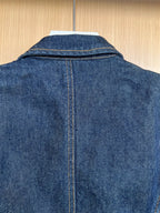 Denim jacket back close-up with center seam and top yoke stitching