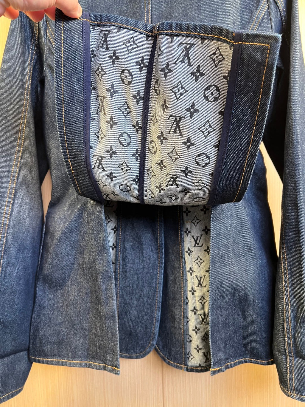 Denim jacket interior lining panel with monogram-style pattern