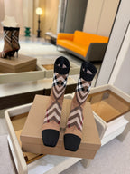 Burberry check knit heeled ankle boots on display, close rear view