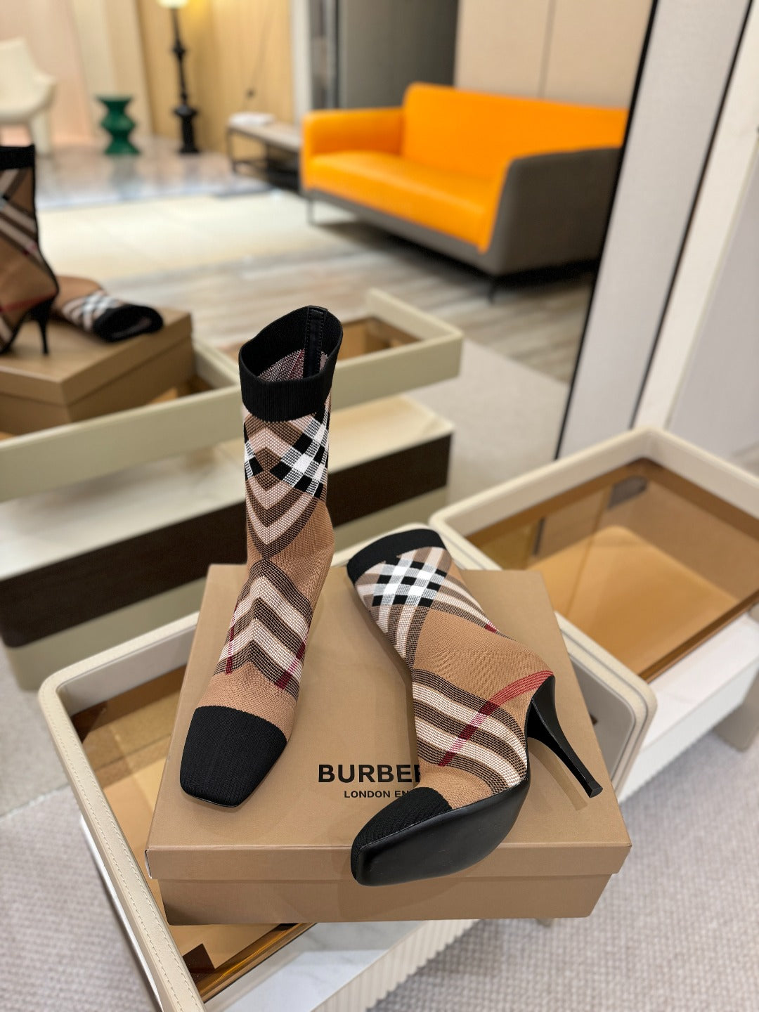 Burberry check knit heeled ankle boots pair on box, side view