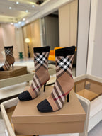 Burberry check knit heeled ankle boots pair on box, angled front view