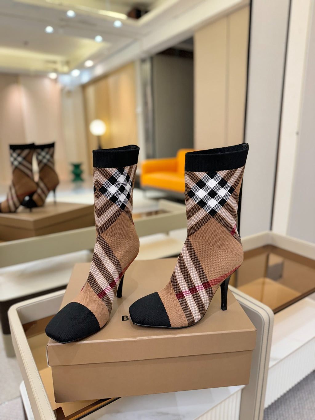 Burberry check knit heeled ankle boots pair on box, front view