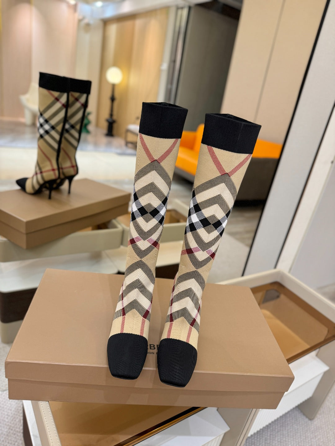Tartan sock-style boots with black top and check panel, low platform sole, stiletto heel