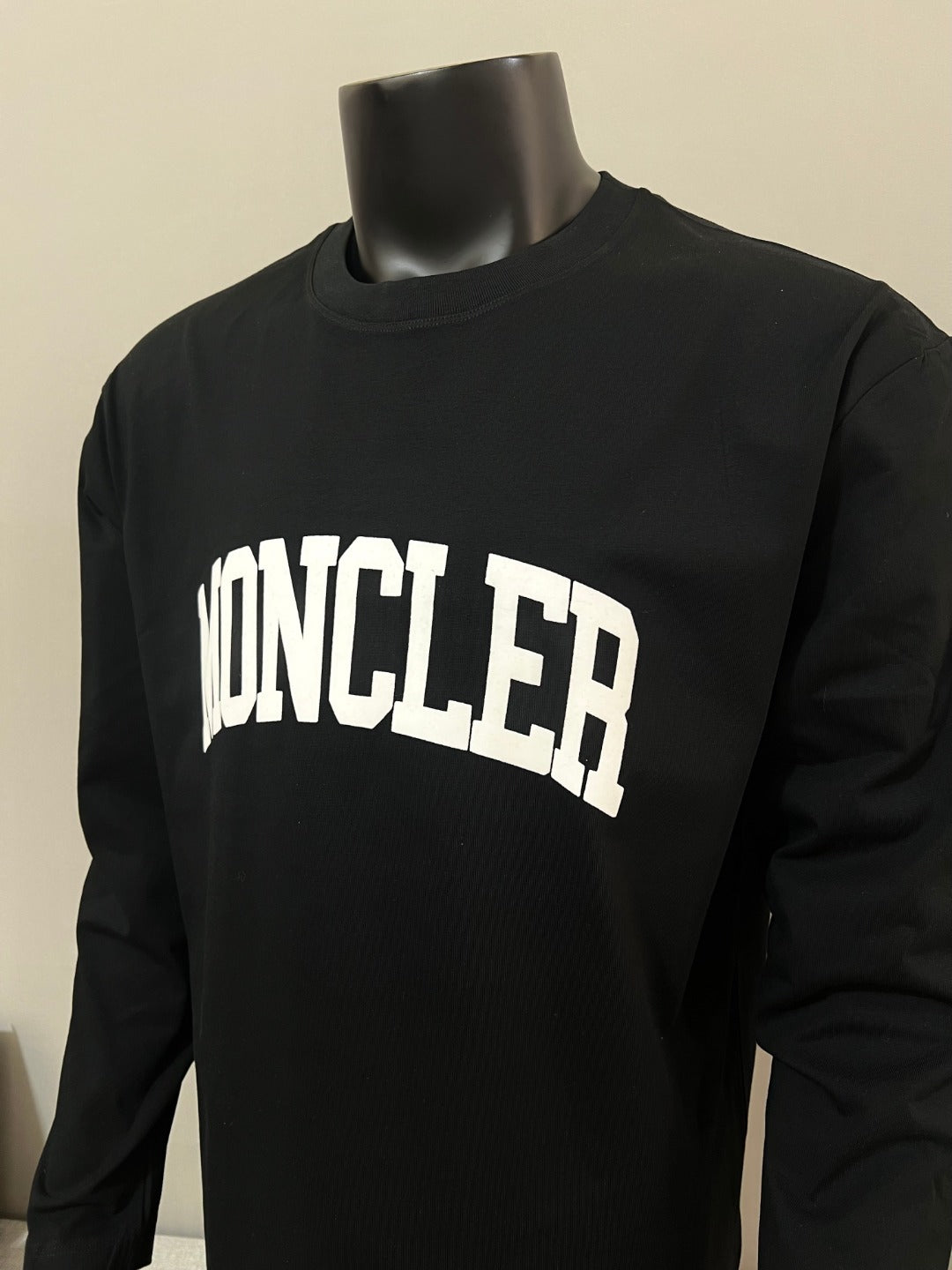 Black Moncler long-sleeve T-shirt front view with white MONCLER logo