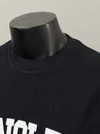 Black Moncler long-sleeve T-shirt neckline close-up with white MONCLER text