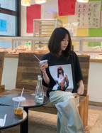 Black graphic T-shirt with square portrait photo print on front