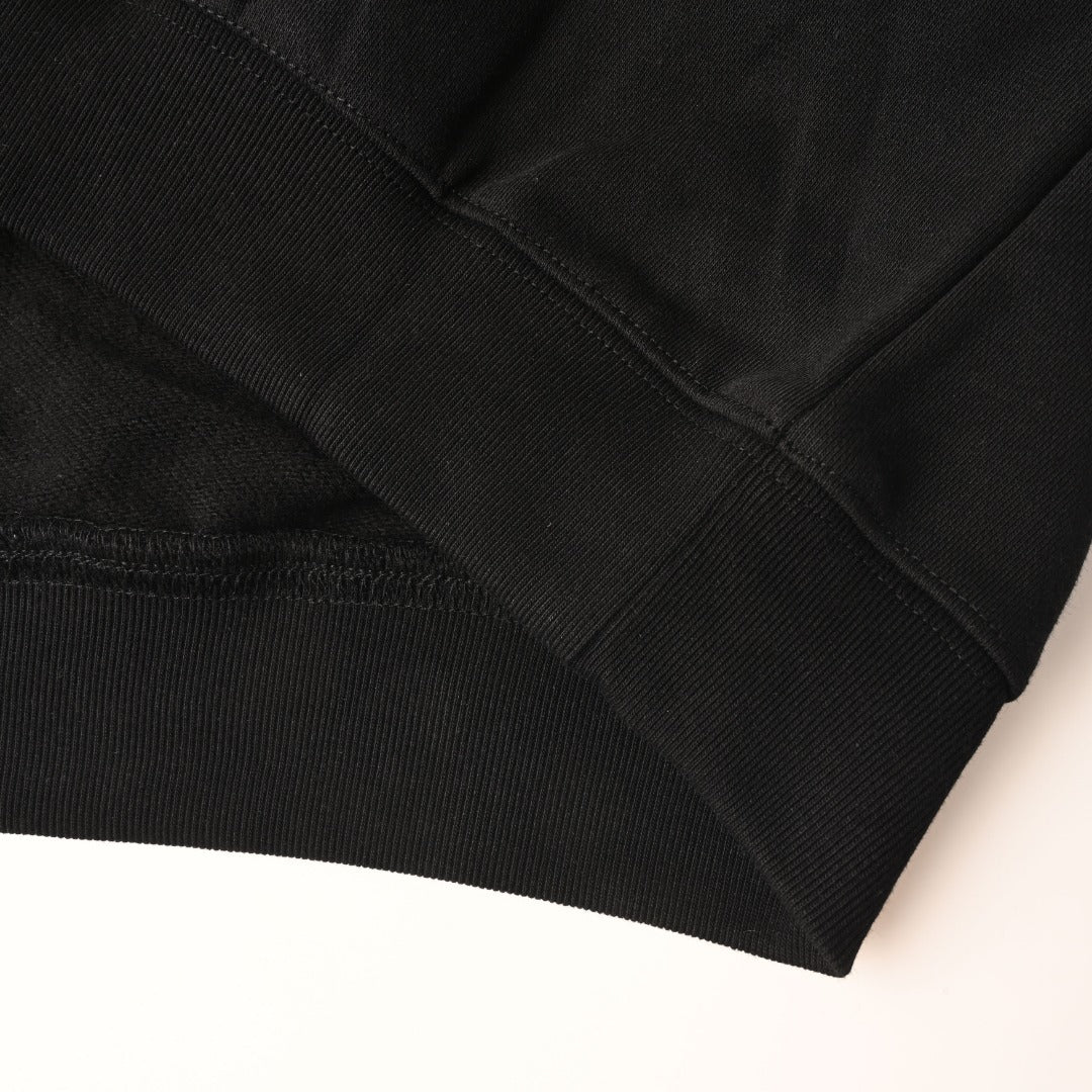 Black hoodie ribbed hem and seam detail