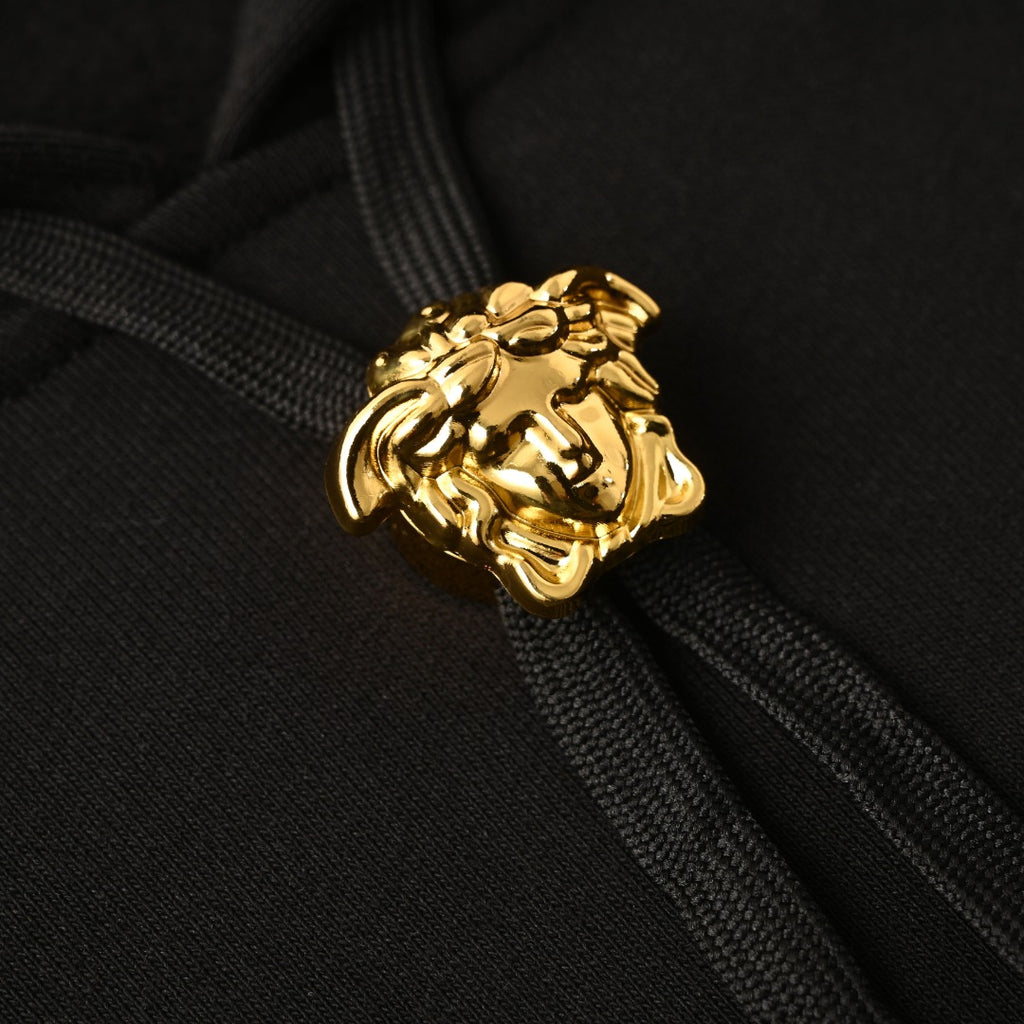 Versace gold lion crest on black hoodie drawstring ends