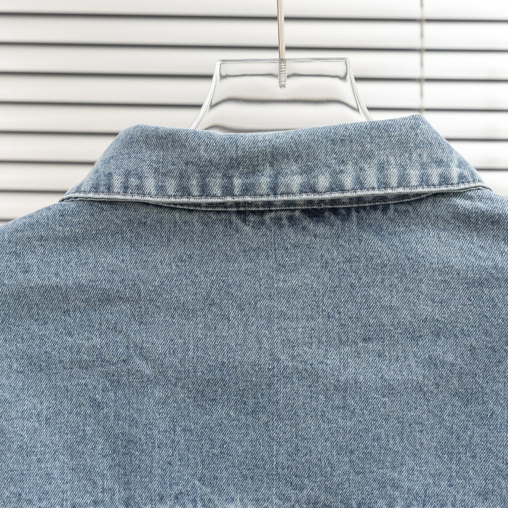 Light blue denim jacket collar with top seam details