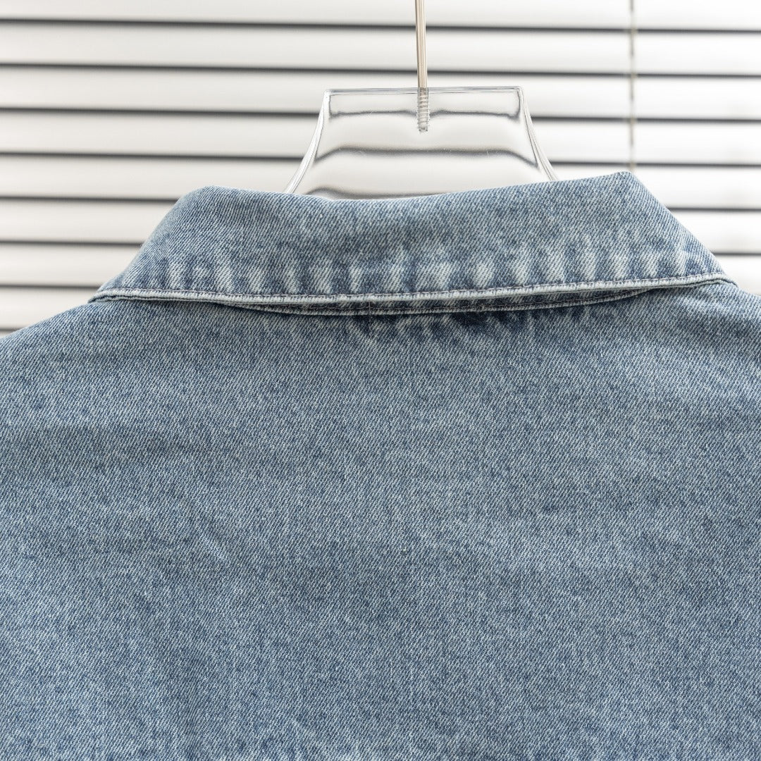 Light blue denim jacket collar with top seam details