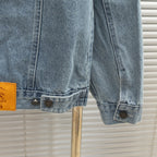Light blue denim jacket sleeve cuff with button tabs and stitching