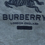Light blue denim jacket logo text: BURBERRY LONDON ENGLAND
