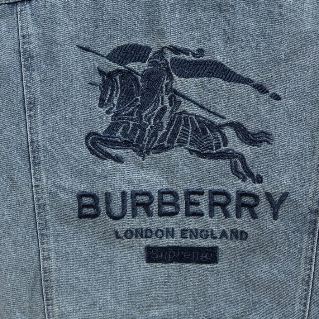 Light blue denim jacket back graphic with Burberry logo and text