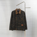 Louis Vuitton long denim jacket with tan corduroy collar and gold logo pattern