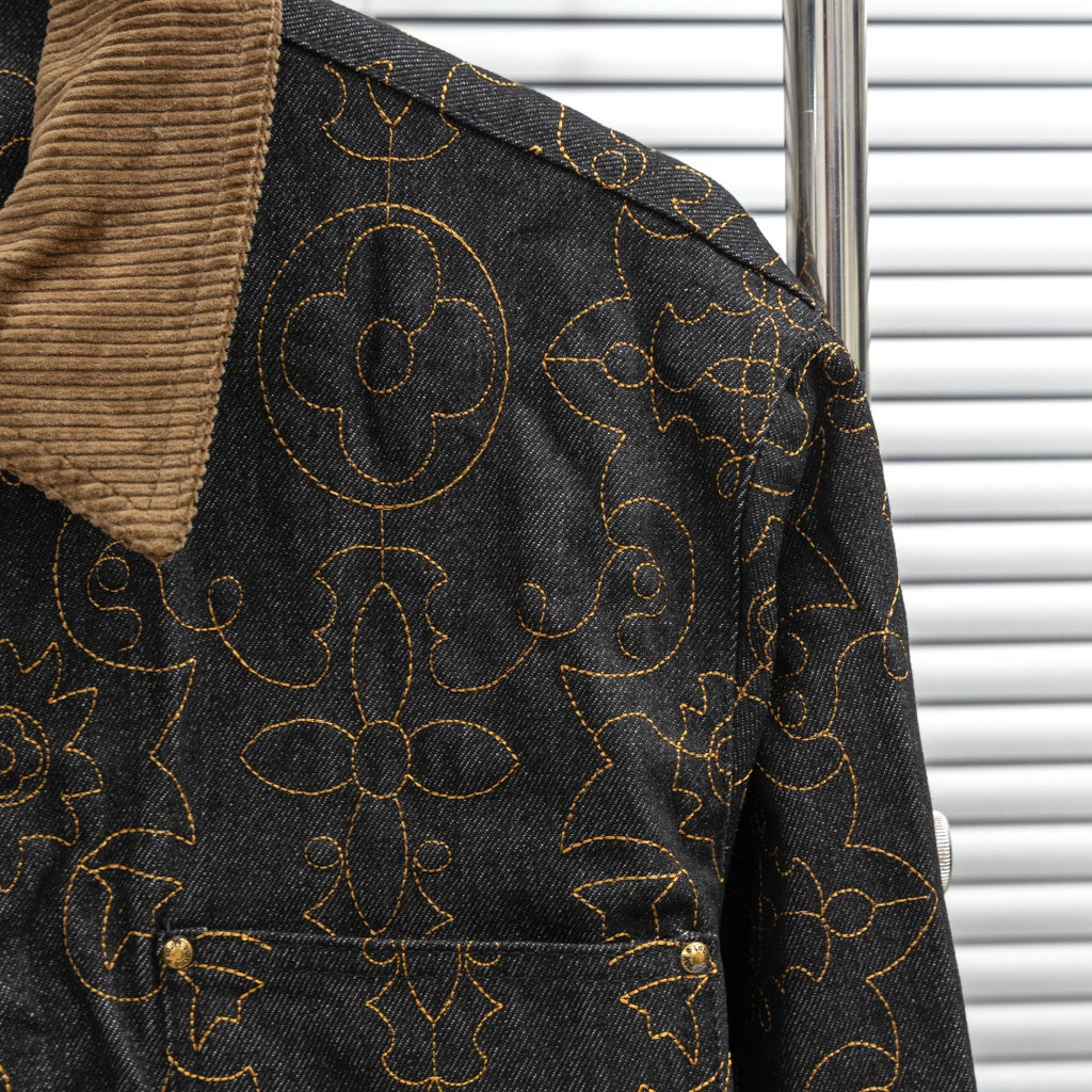 Louis Vuitton long denim jacket side detail with tan corduroy collar and gold pattern