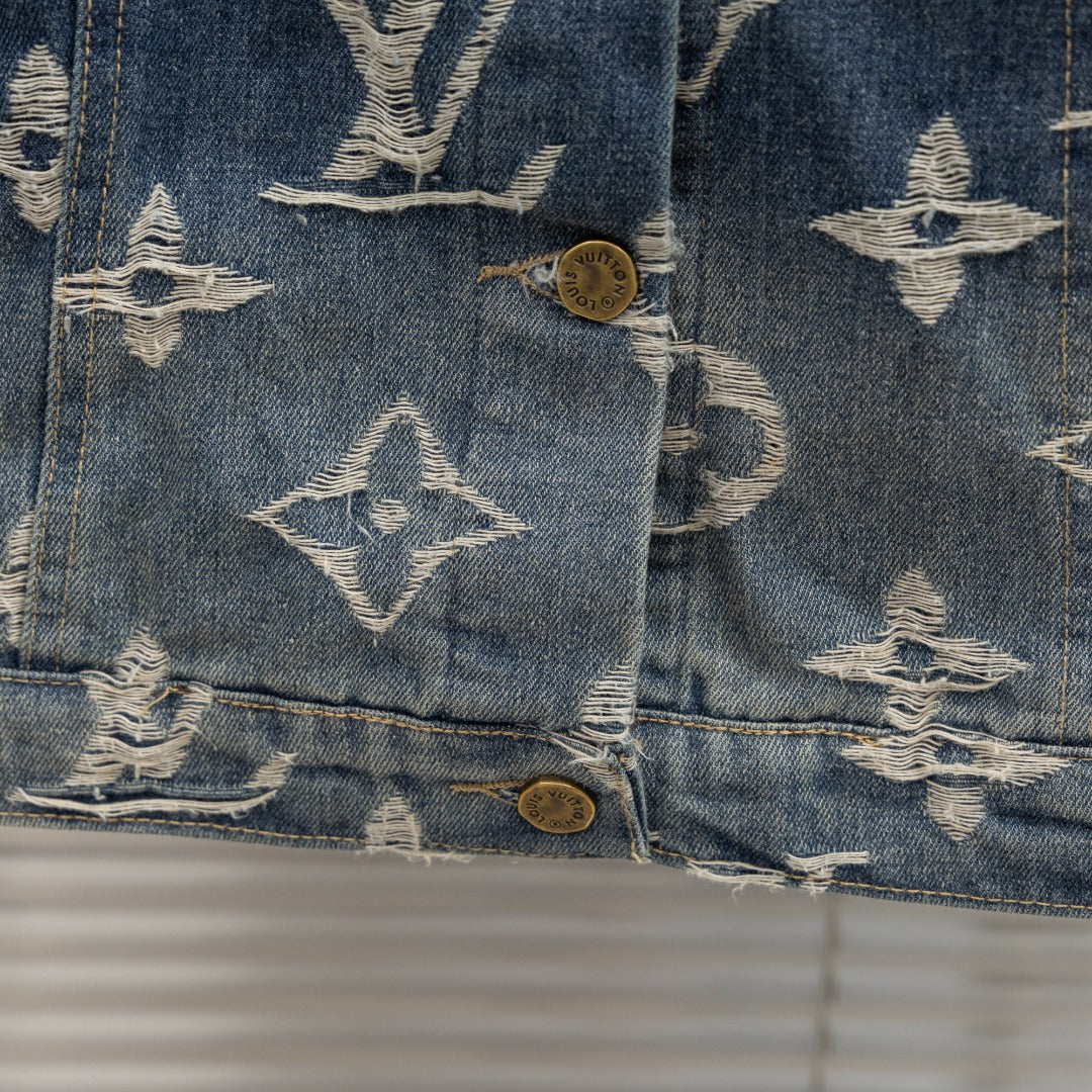 Denim jacket lower front with Louis Vuitton monogram print, flap and gold buttons