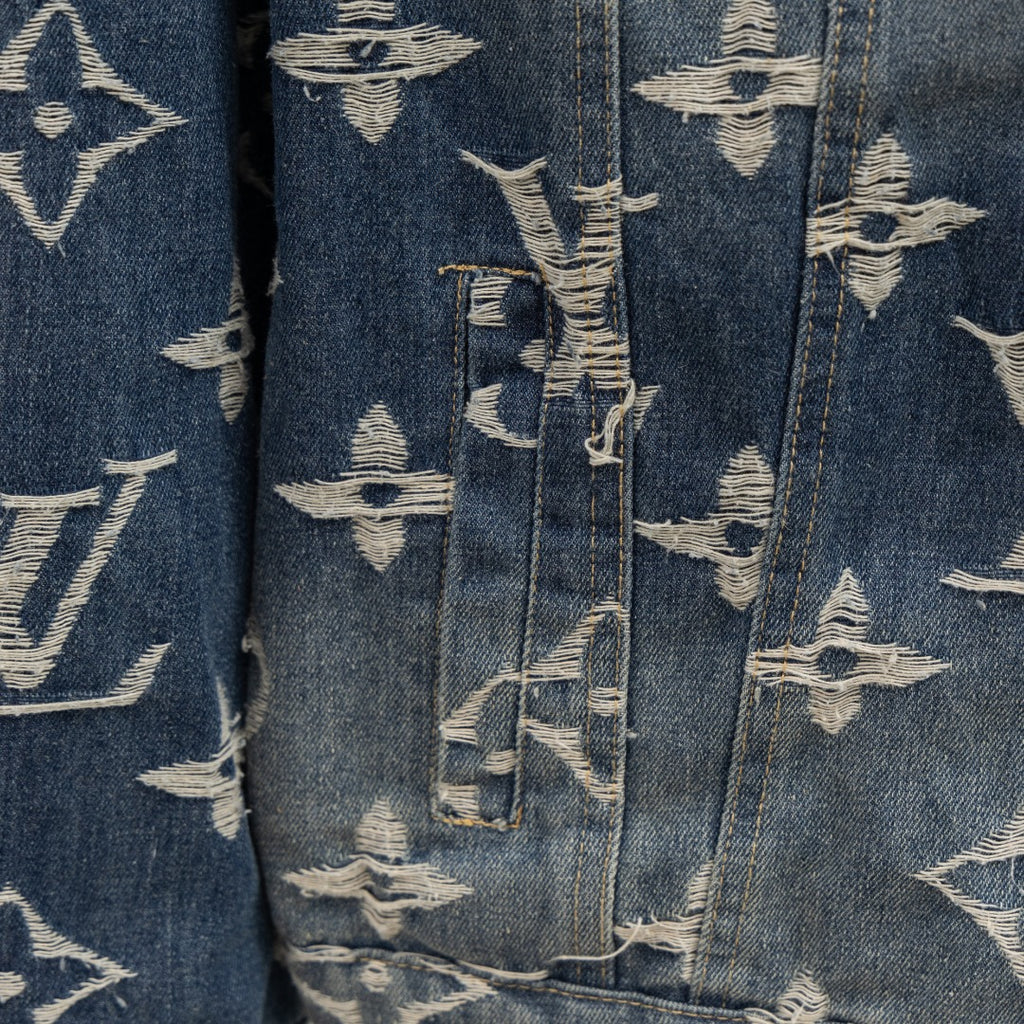 Denim jacket side seam with Louis Vuitton monogram print, vertical panel and distress