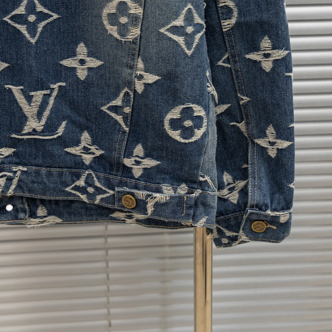 Louis Vuitton denim jacket sleeve detail with allover monogram print and button cuff