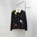 Black denim jacket with white sherpa collar and multicolor cross patches