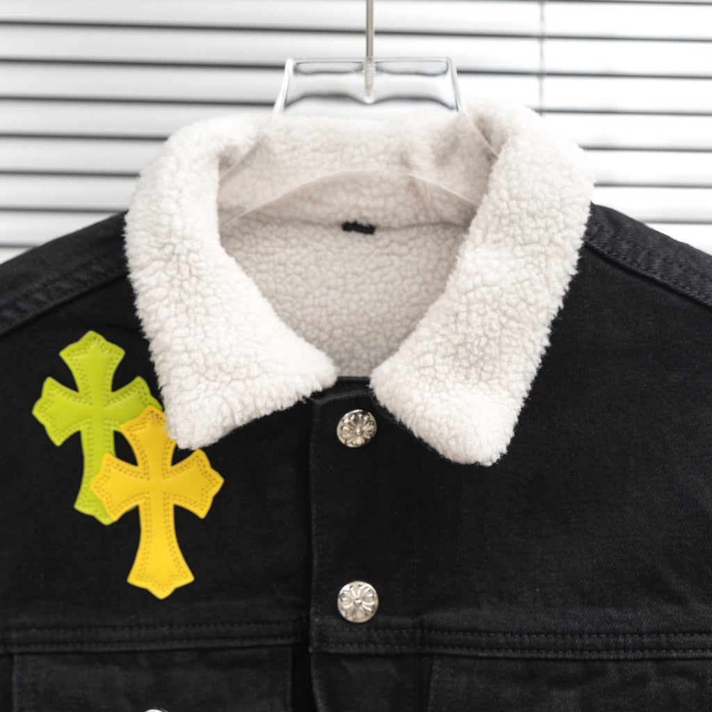 Black denim jacket collar with white sherpa lining and snap buttons
