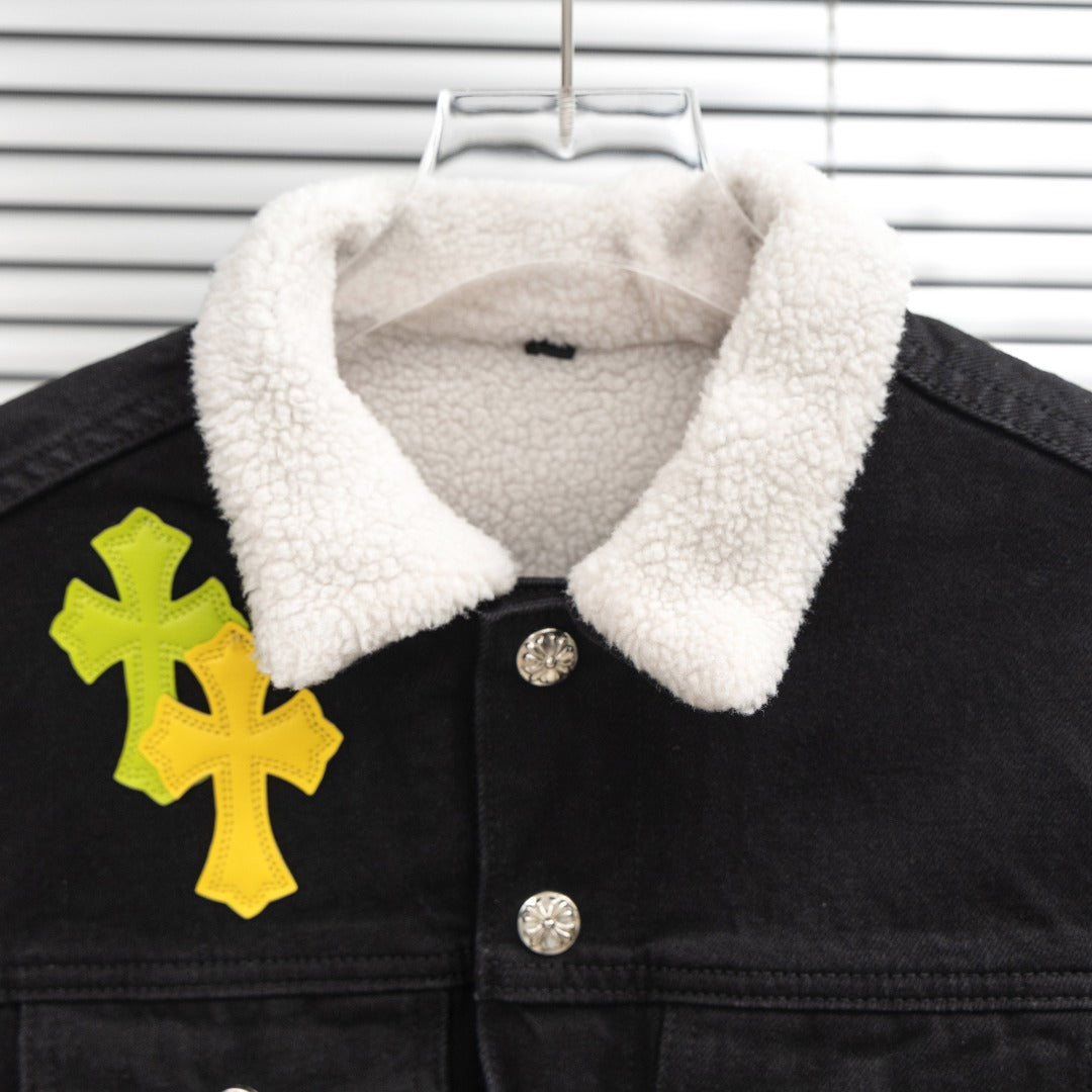 Black denim jacket collar with white sherpa lining and snap buttons