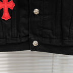 Black denim jacket with red cross patch on left chest