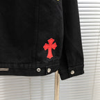 Black denim jacket sleeve with red cross patch and metal button cuff