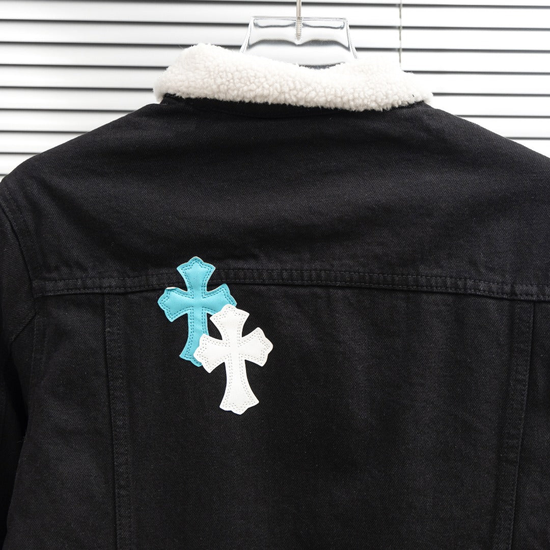 Black denim jacket with sherpa-lined collar and cross patch at back