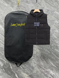 Black long padded vest with hood, front zipper, triangle logo patch
