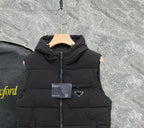 Black long padded vest with hood, front zipper, triangle metal logo