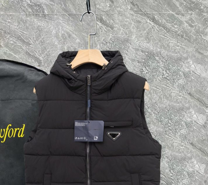 Black long padded vest with hood, front zipper, triangle metal logo