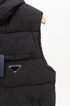 Black long padded vest with front zip and chest pocket detail